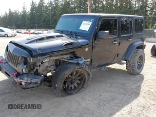 2015 Jeep Wrangler Unlimited Willys Wheeler with VIN 1C4BJWDG9FL750049, listed as a IAAI auction lot 42136188 with 115,328 mi miles and . Bid and sale history available at DreamBid. Image 18.