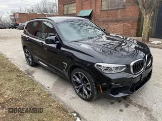 2021 BMW X3 M with VIN 5YMTS0C05M9G46973, listed as a IAAI auction lot 41334083 with 42,819 mi miles. Bid and sale history available at carsss.com. Image 2.