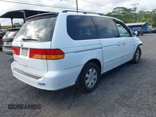 2004 Honda Odyssey EX-L with VIN 5FNRL18924B064040, listed as a IAAI auction lot 41350306 with 130,803 mi miles and . Bid and sale history available at DreamBid. Image 4.
