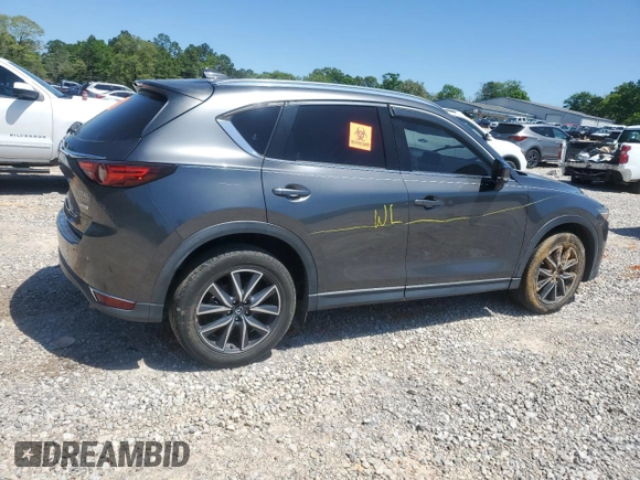 2018 Mazda CX-5 Grand Touring with VIN JM3KFADM9J0343621, listed as a Copart auction lot 52284475 with 129,776 mi miles and Salvage Title. Bid and sale history available at DreamBid. Image 3.