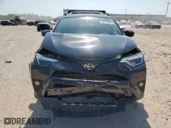 2018 Toyota RAV4 SE with VIN 2T3NFREV6JW436488, listed as a Copart auction lot 60297905 with 74,034 mi miles and Salvage title. Bid and sale history available at DreamBid. Image 5.