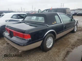 1995 Mercury Cougar z VIN 1MELM62W3SH605641, wystawiony jako Copart lot #84732824 z przebiegiem 40 675 mil mil oraz Szkody całkowita. Historia ofert i sprzedaży dostępna na DreamBid. Obrazek 3.