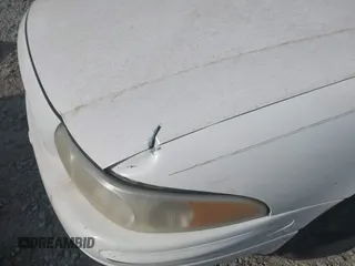 2001 Buick LeSabre Limited z VIN 1G4HR54K51U137832, wystawiony jako IAAI lot #42068730 z przebiegiem 262 640 mil mil oraz . Historia ofert i sprzedaży dostępna na DreamBid. Obrazek 6.