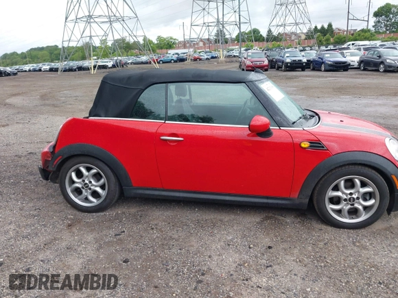 2011 MINI Convertible with VIN WMWZN3C59BTZ89447, listed as a IAAI auction lot 42313009 with 62,009 mi miles and . Bid and sale history available at DreamBid. Image 14.