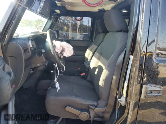 2018 Jeep Wrangler JK Unlimited Sport S with VIN 1C4HJWDG5JL928106, listed as a Copart auction lot 77670184 with 70,228 mi miles and Salvage Title. Bid and sale history available at carsss.com. Image 7.