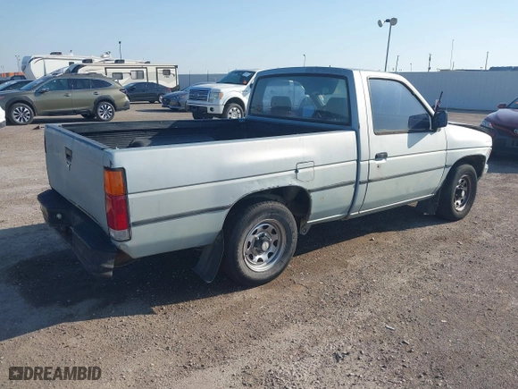 1990 Nissan Trucks 2WD XE with VIN 1N6SD11S4LC400985, listed as a IAAI auction lot 41986390 with 189,924 mi miles. Bid and sale history available at carsss.com. Image 4.