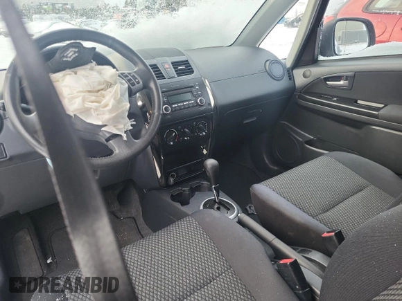 2013 Suzuki SX4 z VIN JS2YA5A34D6100052, wystawiony jako Copart lot #85862654 z przebiegiem 105 114 mil mil oraz Tytuł czysty. Historia ofert i sprzedaży dostępna na DreamBid. Obrazek 8.