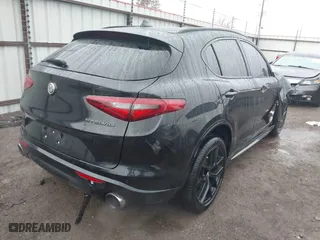 2021 Alfa Romeo Stelvio Ti with VIN ZASPAKBN0M7D02795, listed as a IAAI auction lot 41052309 with 83,584 mi miles. Bid and sale history available at carsss.com. Image 4.
