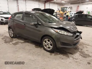 2015 Ford Fiesta SE with VIN 3FADP4EJ8FM138306, listed as a IAAI auction lot 41227124 with 106,741 mi miles. Bid and sale history available at carsss.com. Image 1.