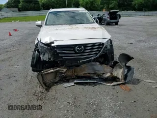 2019 Mazda CX-9 Touring z VIN JM3TCBCY9K0305038, wystawiony jako Copart lot #56707735 z przebiegiem 76 546 mil mil oraz Szkoda całkowita • Salvage title. Historia ofert i sprzedaży dostępna na DreamBid. Obrazek 14.