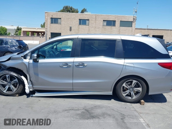 2018 Honda Odyssey Touring with VIN 5FNRL6H81JB022975, listed as a IAAI auction lot 42653304 with 210,137 mi miles and . Bid and sale history available at DreamBid. Image 15.