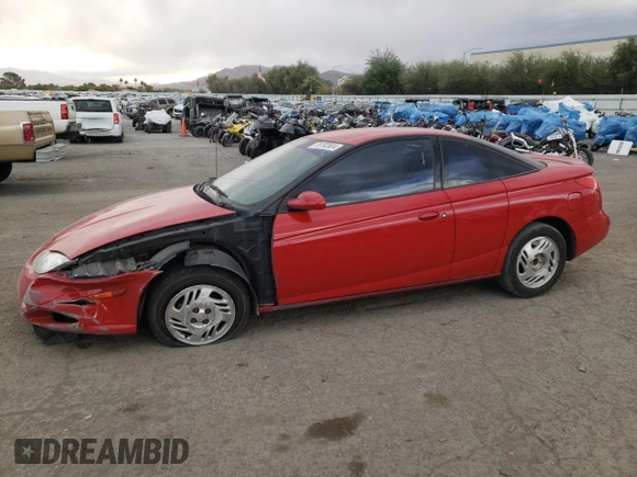 2001 Saturn SC z VIN 1G8ZY12701Z201761, wystawiony jako Copart lot #76792804 z przebiegiem 85 352 mil mil oraz Szkody całkowita. Historia ofert i sprzedaży dostępna na DreamBid. Obrazek 1.