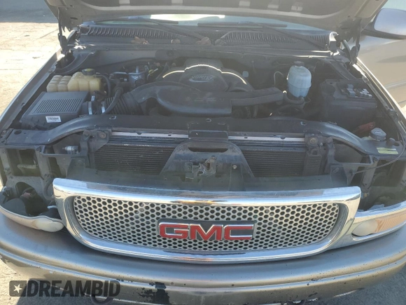 2003 GMC Yukon Denali z VIN 1GKEK63U93J339277, wystawiony jako Copart lot #42454275 z przebiegiem Nie podano mil oraz Szkody całkowita. Historia ofert i sprzedaży dostępna na DreamBid. Obrazek 12.