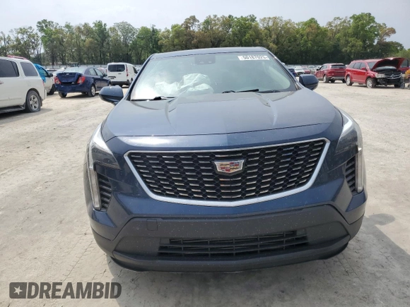 2022 Cadillac XT4 FWD Luxury z VIN 1GYAZAR47NF120348, wystawiony jako Copart lot #50187025 z przebiegiem 76 886 mil mil oraz Nie do naprawy • Non repairable. Historia ofert i sprzedaży dostępna na DreamBid. Obrazek 5.