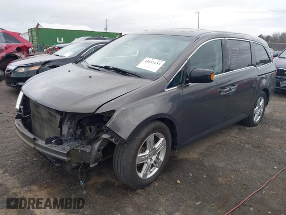 2012 Honda Odyssey Touring with VIN 5FNRL5H99CB071010, listed as a IAAI auction lot 41651233 with 186,913 mi miles. Bid and sale history available at carsss.com. Image 2.