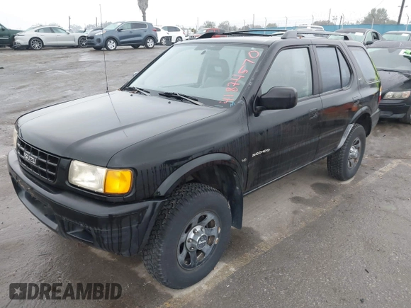 1998 Isuzu Rodeo S z VIN 4S2CM58W6W4336183, wystawiony jako IAAI lot #41874570 z przebiegiem 162 097 mil mil oraz . Historia ofert i sprzedaży dostępna na DreamBid. Obrazek 2.