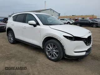 2021 Mazda CX-5 Grand Touring with VIN JM3KFBDM7M1122281, listed as a Copart auction lot 54576485 with 93,008 mi miles and Salvage Title. Bid and sale history available at DreamBid. Image 4.