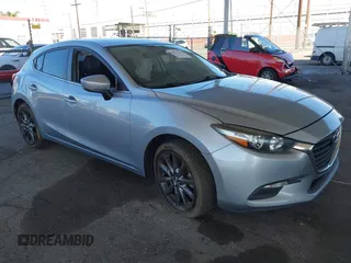 2018 Mazda 3 Touring with VIN 3MZBN1L31JM163466, listed as a IAAI auction lot 40777124 with 101,497 mi miles. Bid and sale history available at carsss.com. Image 1.