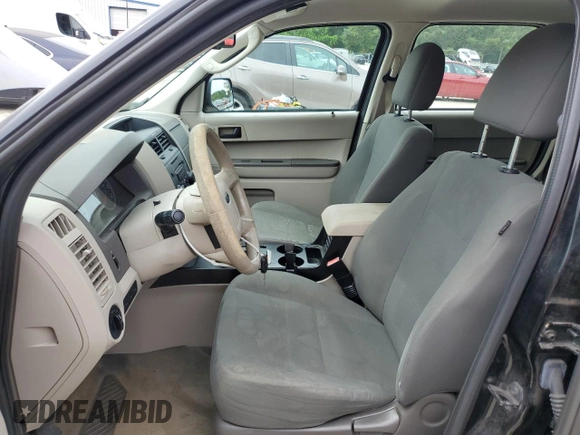 2012 Ford Escape XLS with VIN 1FMCU9C71CKA30319, listed as a Copart auction lot 60189745 with 214,736 mi miles and Salvage title. Bid and sale history available at DreamBid. Image 7.
