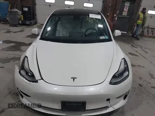 2021 Tesla Model 3 Long Range with VIN 5YJ3E1EBXMF051060, listed as a IAAI auction lot 41958018 with 65,631 mi miles. Bid and sale history available at carsss.com. Image 12.