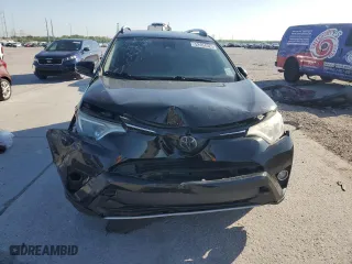 2018 Toyota RAV4 XLE with VIN 2T3WFREV2JW472232, listed as a Copart auction lot 52464025 with 131,421 mi miles and Salvage Title. Bid and sale history available at carsss.com. Image 5.