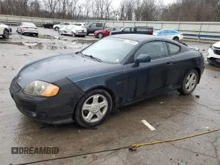 2003 Hyundai Tiburon GT z VIN KMHHN65F13U068658, wystawiony jako Copart lot #81799404 z przebiegiem 163 148 mil mil oraz Szkoda całkowita • Salvage title. Historia ofert i sprzedaży dostępna na DreamBid. Obrazek 1.