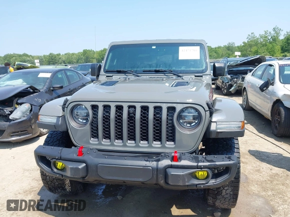 2021 Jeep Gladiator Rubicon with VIN 1C6JJTBG2ML515932, listed as a IAAI auction lot 42471704 with 57,775 mi miles and . Bid and sale history available at DreamBid. Image 13.