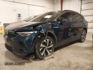 2023 Volkswagen ID.4 Pro z VIN 1V2DNPE84PC038042, wystawiony jako IAAI lot #41446269 z przebiegiem 12 878 mil mil oraz . Historia ofert i sprzedaży dostępna na DreamBid. Obrazek 2.