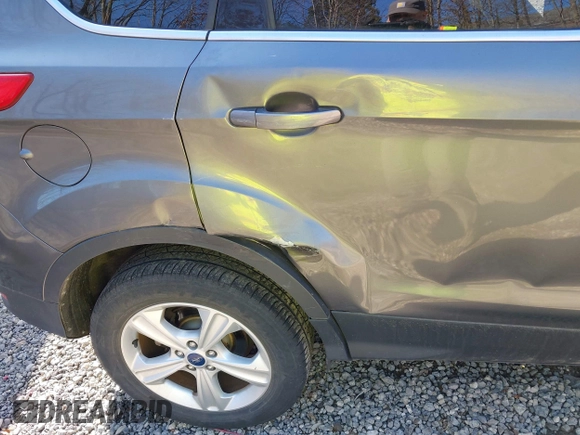 2014 Ford Escape SE z VIN 1FMCU0G99EUB25967, wystawiony jako IAAI lot #41805970 z przebiegiem 72 770 mil mil oraz . Historia ofert i sprzedaży dostępna na DreamBid. Obrazek 17.
