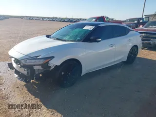 2020 Nissan Maxima SR with VIN 1N4AA6EVXLC365710, listed as a IAAI auction lot 40969464 with 74,320 mi miles and . Bid and sale history available at DreamBid. Image 2.
