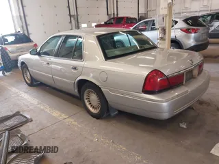 2000 Mercury Grand Marquis LS z VIN 2MEFM75W0YX736324, wystawiony jako IAAI lot #41865927 z przebiegiem 136 886 mil mil oraz . Historia ofert i sprzedaży dostępna na DreamBid. Obrazek 3.