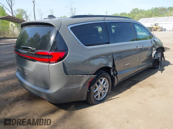 2022 Chrysler Pacifica Touring L with VIN 2C4RC1BG3NR168565, listed as a IAAI auction lot 42150290 with 61,750 mi miles and . Bid and sale history available at DreamBid. Image 4.