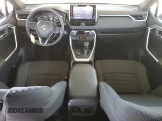 2022 Toyota RAV4 Hybrid SE with VIN 4T3T6RFV7NU103423, listed as a Copart auction lot 59709215 with 27,595 mi miles and Salvage title. Bid and sale history available at DreamBid. Image 8.