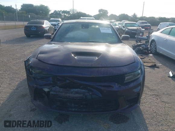 2021 Dodge Charger Scat Pack Widebody with VIN 2C3CDXGJXMH559036, listed as a IAAI auction lot 41895328 with 55,017 mi miles and . Bid and sale history available at DreamBid. Image 12.