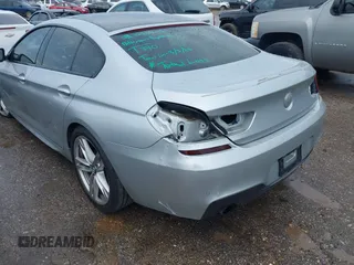 2015 BMW 6 Series 640i z VIN WBA6A0C51FD318982, wystawiony jako IAAI lot #41875547 z przebiegiem 60 968 mil mil oraz . Historia ofert i sprzedaży dostępna na DreamBid. Obrazek 17.