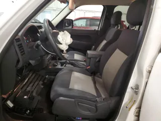 2010 Jeep Liberty Sport with VIN 1J4PN2GK2AW115064, listed as a Copart auction lot 57344645 with 114,275 mi miles and Salvage title. Bid and sale history available at DreamBid. Image 7.