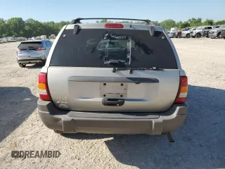 2004 Jeep Grand Cherokee Laredo with VIN 1J4GW48S34C307347, listed as a Copart auction lot 55749565 with Not provided miles and Salvage title. Bid and sale history available at DreamBid. Image 6.