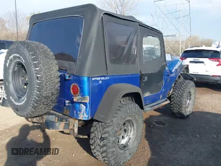1995 Jeep Wrangler S with VIN 1J4FY19P3SP260597, listed as a IAAI auction lot 41883021 with 176,555 mi miles. Bid and sale history available at carsss.com. Image 4.