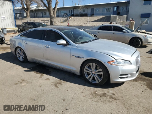 2014 Jaguar XJ Portfolio with VIN SAJWA2GZ2E8V70065, listed as a Copart auction lot 43872505 with 138,677 mi miles and Salvage title. Bid and sale history available at DreamBid. Image 4.