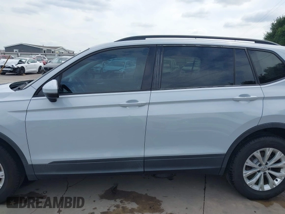 2018 Volkswagen Tiguan S with VIN 3VV1B7AX0JM092116, listed as a IAAI auction lot 42388339 with 103,412 mi miles and . Bid and sale history available at DreamBid. Image 14.