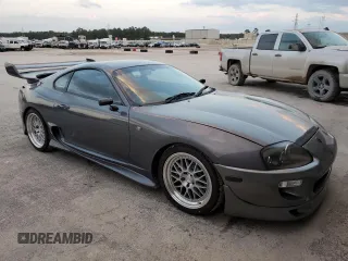 1996 Toyota Supra с VIN JZA800034162, выставлен на аукционе Copart как лот 80046394 с пробегом 86 285 миль миль и Чистый • Clean title. История ставок и продаж доступна на DreamBid. Изображение 4.