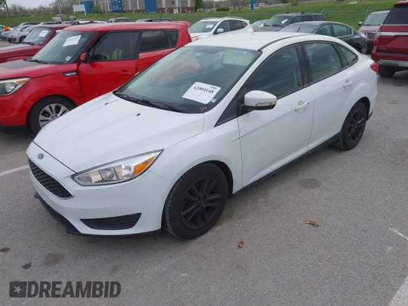 2017 Ford Focus SE z VIN 1FADP3F26HL233226, wystawiony jako IAAI lot #42004148 z przebiegiem 75 180 mil mil oraz . Historia ofert i sprzedaży dostępna na DreamBid. Obrazek 2.