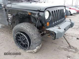 2008 Jeep Wrangler Unlimited X with VIN 1J4GA39138L641138, listed as a IAAI auction lot 41986230 with 215,026 mi miles. Bid and sale history available at carsss.com. Image 6.