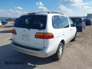 1999 Toyota Sienna LE with VIN 4T3ZF13C1XU152733, listed as a IAAI auction lot 40819395 with 184,540 mi miles. Bid and sale history available at carsss.com. Image 4.