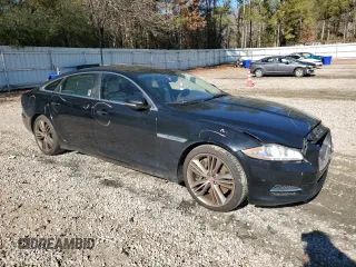 2015 Jaguar XJ with VIN SAJWA2GT8FMV83276, listed as a Copart auction lot 86521754 with 105,010 mi miles and Salvage Title. Bid and sale history available at DreamBid. Image 4.