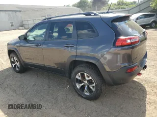 2014 Jeep Cherokee Trailhawk with VIN 1C4PJMBS4EW187085, listed as a Copart auction lot 64106985 with 166,467 mi miles and Clean title. Bid and sale history available at DreamBid. Image 2.