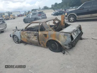 1986 Toyota MR2 z VIN JT2AW15CXG0066425, wystawiony jako Copart lot #74560234 z przebiegiem Nie podano mil oraz Nie do naprawy. Historia ofert i sprzedaży dostępna na DreamBid. Obrazek 2.