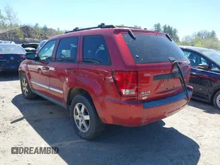 2009 Jeep Grand Cherokee Laredo with VIN 1J8GR48K79C543304, listed as a IAAI auction lot 42151011 with 157,679 mi miles. Bid and sale history available at carsss.com. Image 3.