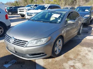 2014 Volkswagen CC Sport with VIN WVWBN7AN1EE518559, listed as a IAAI auction lot 41208853 with 154,957 mi miles. Bid and sale history available at carsss.com. Image 2.