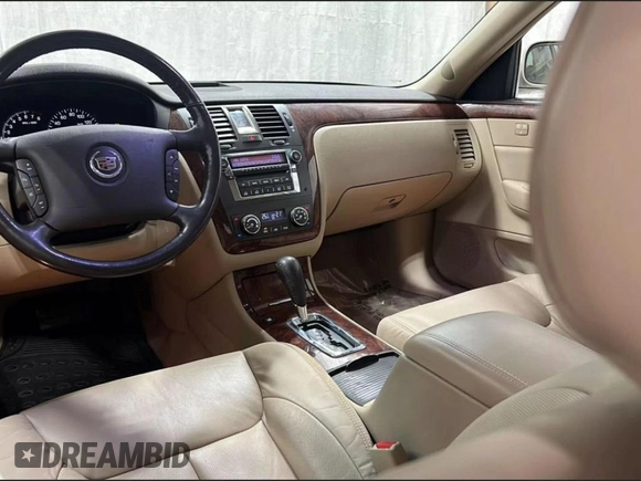 2007 Cadillac DTS V8 z VIN 1G6KD57Y27U198589, wystawiony jako Copart lot #59233755 z przebiegiem 171 023 mil mil oraz Tytuł czysty. Historia ofert i sprzedaży dostępna na DreamBid. Obrazek 9.
